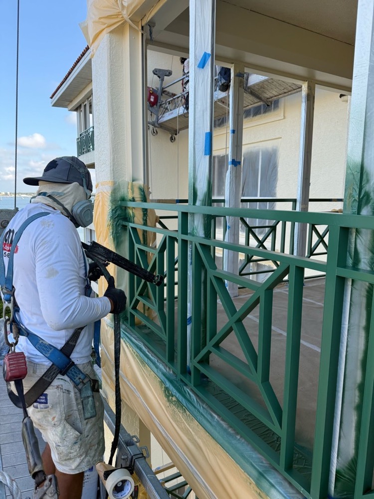 Ascend technician applying an electrostatic coating